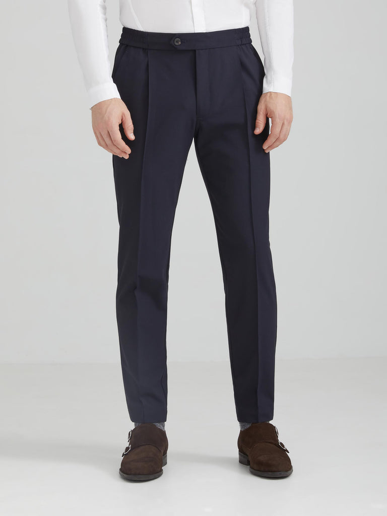 The Vanta Pant by SENECA in Black. Performance AYR fabric from Italy: 4-way stretch, exceptionally soft, machine washable, wrinkle resistant. Comfortable and versatile men's trousers with elastic waistband, 4 pockets, and a button zipper fly. Replace your chinos, jeans, and khakis perfect for back to the office. caption: Justin is 6'1
